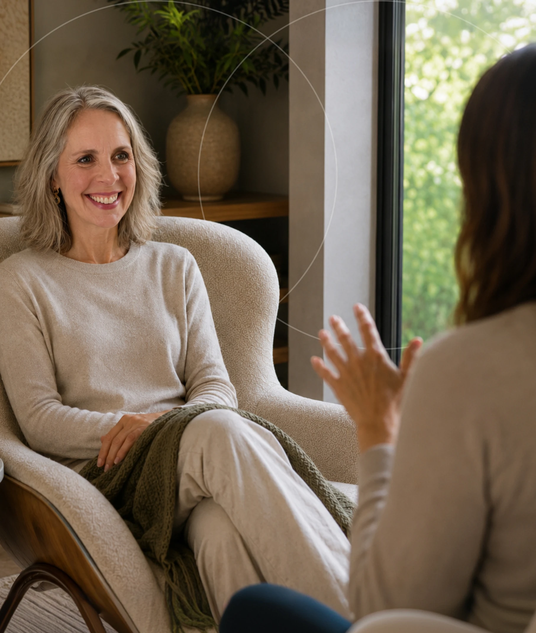 Anthea in conversation with a guest at Restore Body & Mind Studio