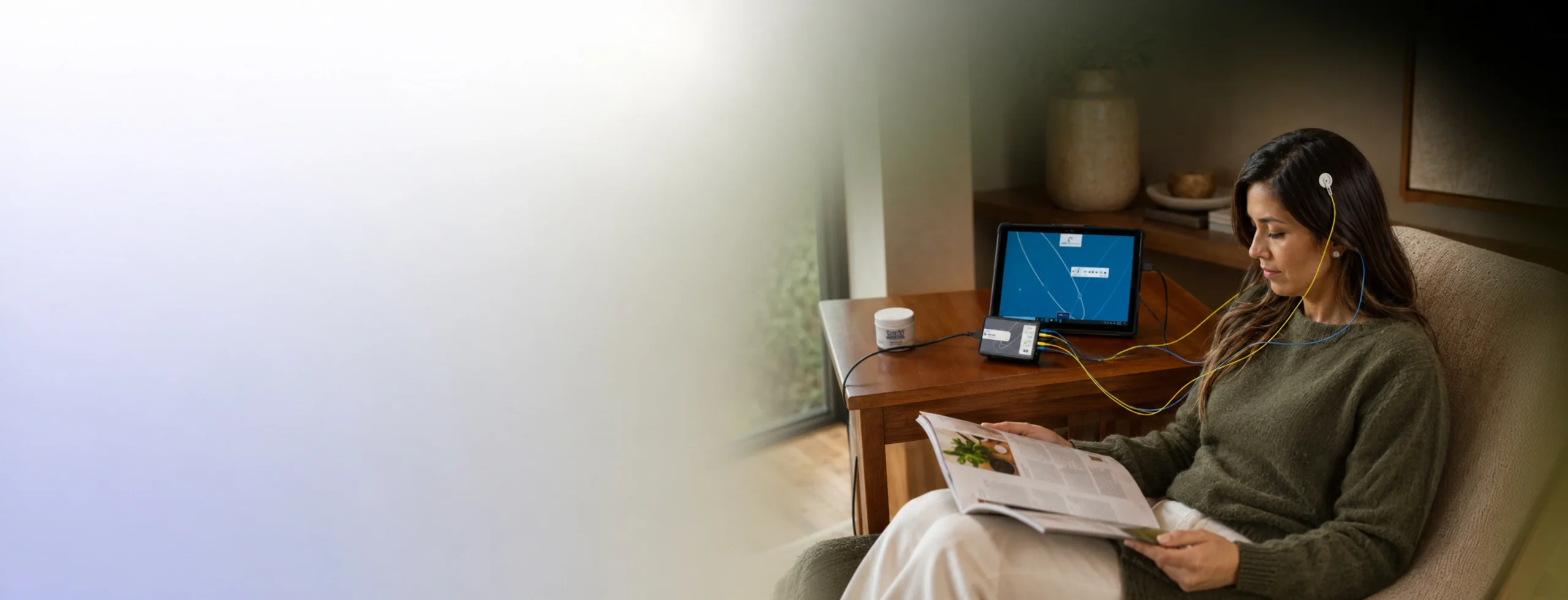 A guest relaxing during a NeurOptimal® neurofeedback session at Restore Body & Mind Studio